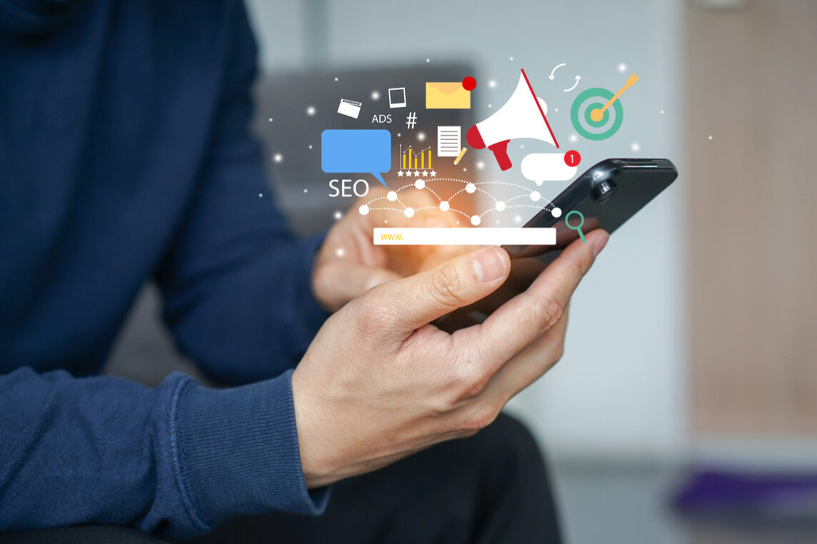 close up young man hand hold smartphone and use application of e-commerce to working about social media marketing tools for business and technology concept bindend referendum