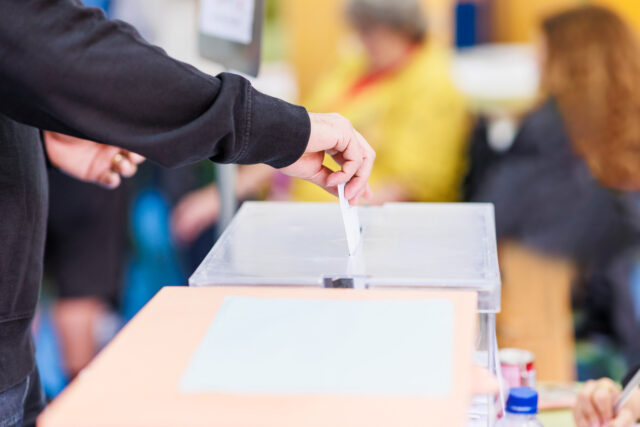 voting candidate campaign in democracy ballot box. Latin mid hand unrecognizable man Stemt u